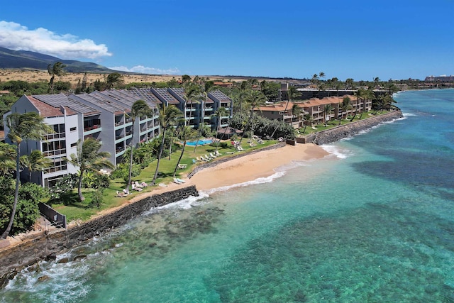 bird's eye view featuring a beach view and a water view