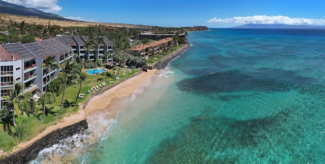 bird's eye view featuring a water view and a view of the beach