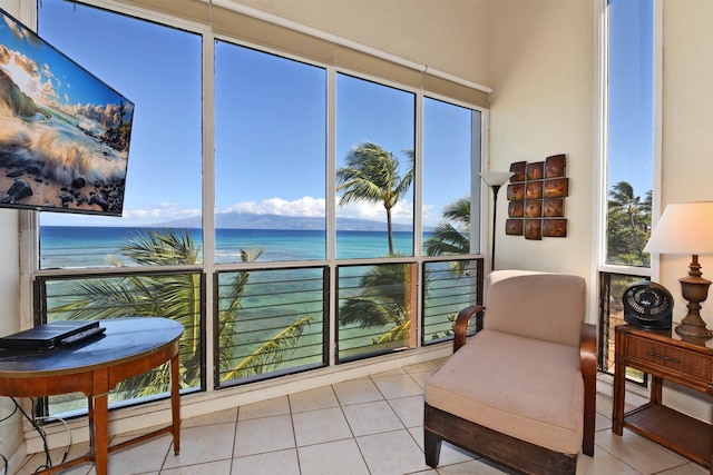 sunroom / solarium with a wealth of natural light and a water view