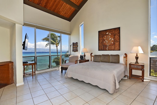 tiled bedroom with a towering ceiling and wood ceiling