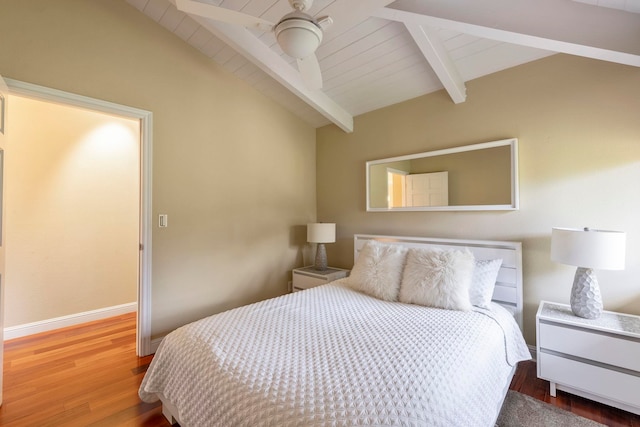 bedroom with lofted ceiling with beams, hardwood / wood-style floors, ceiling fan, and wood ceiling