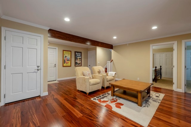 living room featuring dark hardwood / wood-style flooring and crown molding