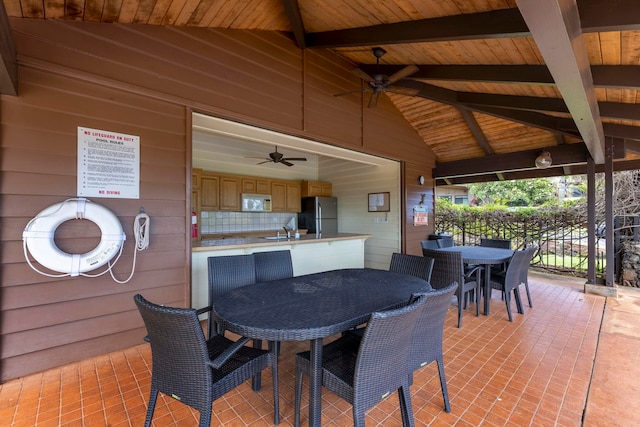 view of patio with sink and ceiling fan