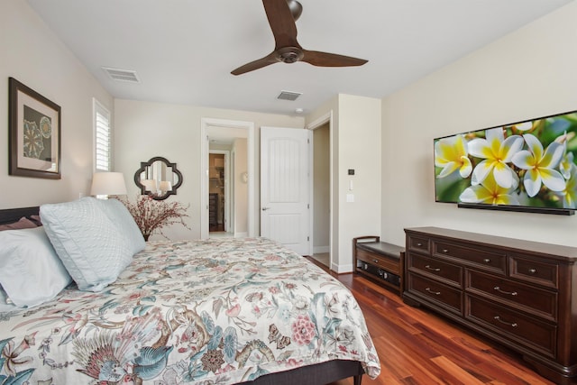 bedroom with visible vents, dark wood finished floors, and ceiling fan