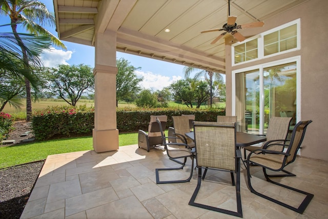 view of patio with outdoor dining space and ceiling fan