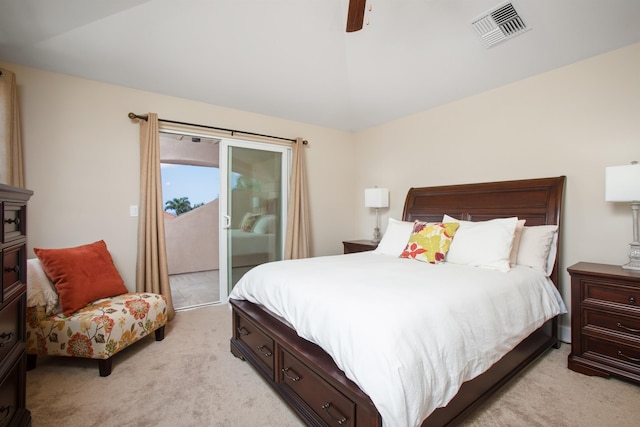 bedroom with light carpet, access to exterior, visible vents, and a ceiling fan