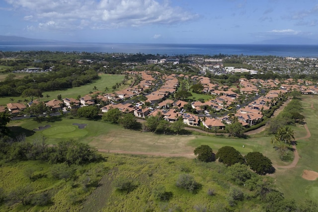 drone / aerial view with a residential view, view of golf course, and a water view