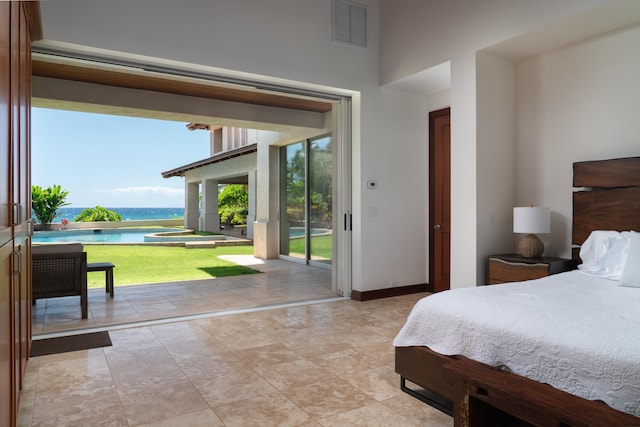 3002 S Kihei Rd, Kihei, HI 96753 - bedroom featuring access to exterior, a water view, and a towering ceiling