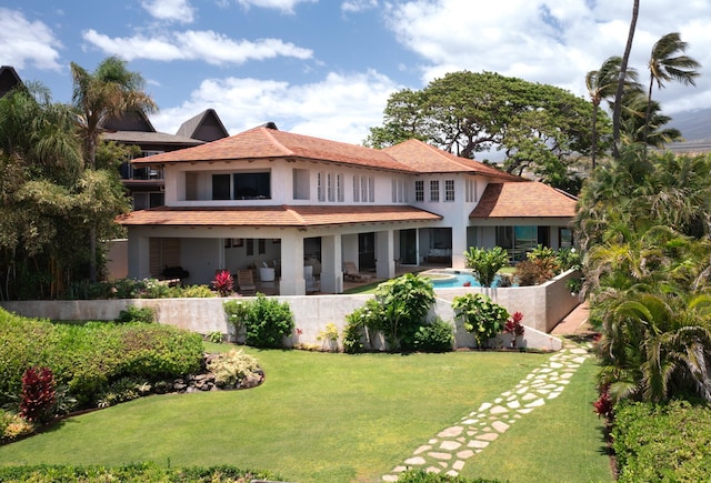 3002 S Kihei Rd, Kihei, HI 96753 - rear view of house with stucco siding and a lawn
