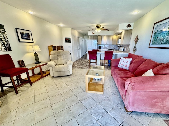 living room with light tile patterned floors and ceiling fan