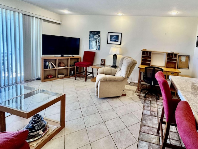 living room featuring light tile patterned floors, recessed lighting, and a healthy amount of sunlight