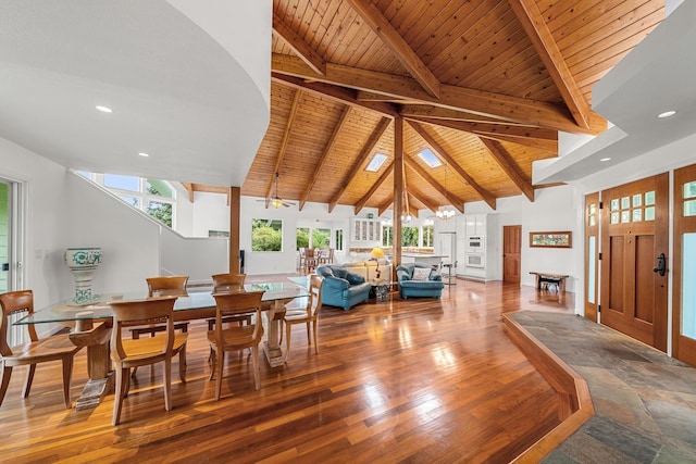 dining space with beamed ceiling, wooden ceiling, high vaulted ceiling, and hardwood / wood-style flooring