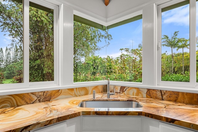 sunroom with plenty of natural light and wet bar