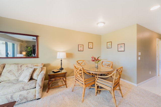 dining area featuring light colored carpet