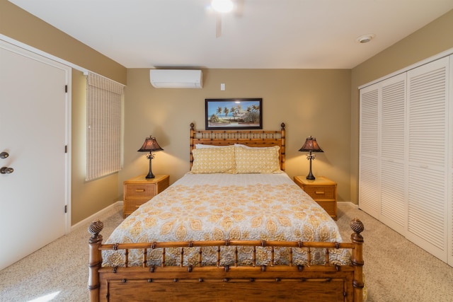 bedroom featuring a wall mounted AC, carpet, and a closet