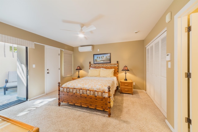 carpeted bedroom featuring ceiling fan and a wall mounted AC