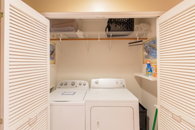 clothes washing area featuring washer and dryer