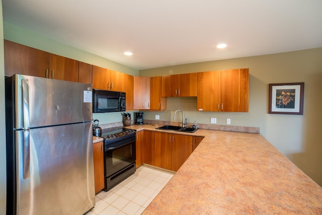 kitchen with sink, light colored carpet, and black appliances