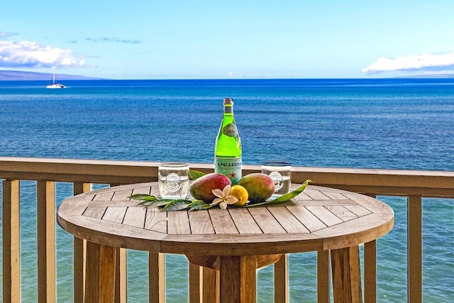 balcony featuring a water view