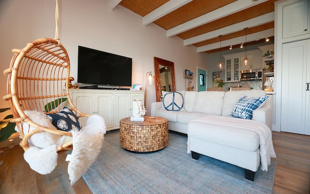 living room featuring beamed ceiling and dark wood-type flooring