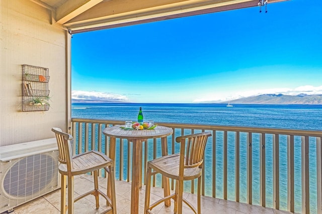 balcony with a water and mountain view