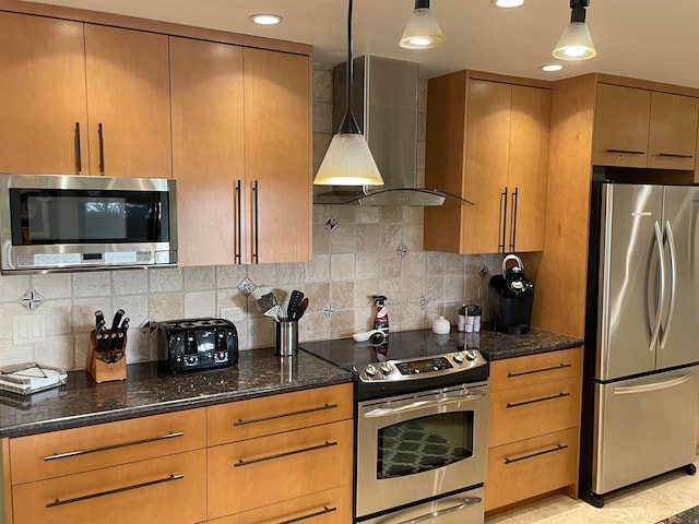 kitchen with backsplash, dark stone countertops, appliances with stainless steel finishes, and wall chimney range hood