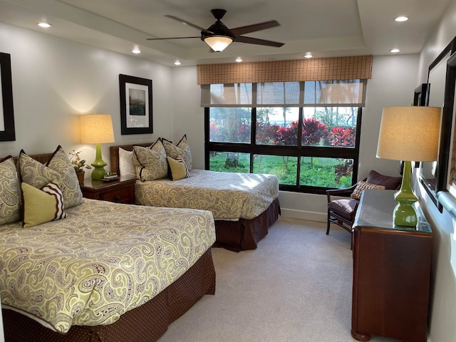 bedroom with light carpet and ceiling fan