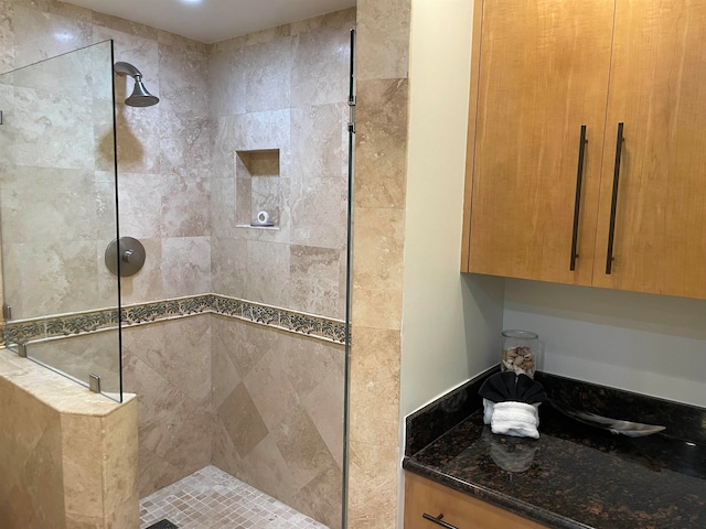 bathroom with tiled shower