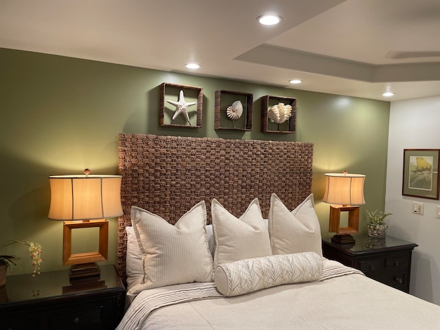 bedroom with a tray ceiling