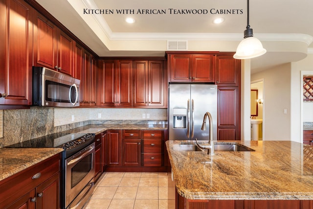 kitchen featuring decorative backsplash, stainless steel appliances, sink, decorative light fixtures, and stone countertops