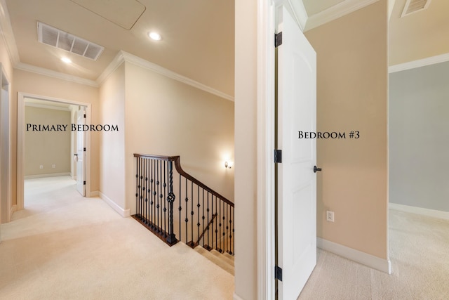 corridor with light colored carpet and ornamental molding