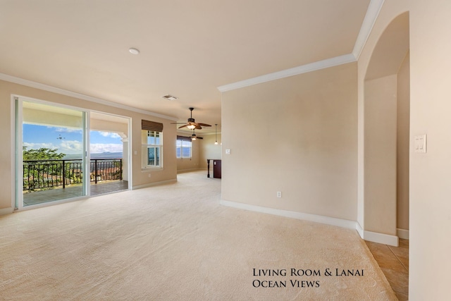 unfurnished living room with ceiling fan, light carpet, and ornamental molding