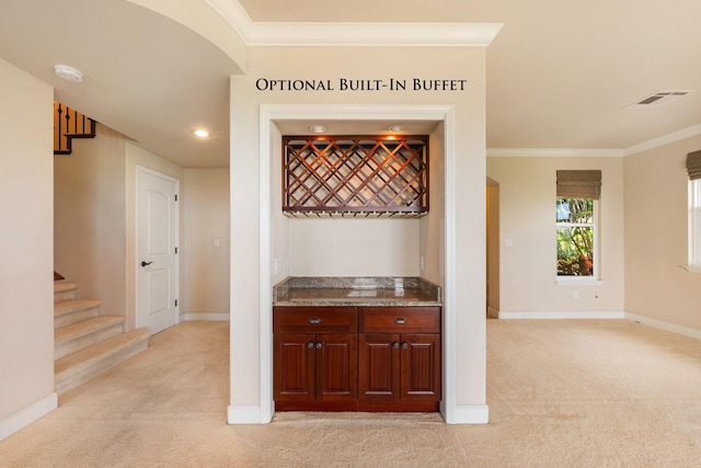 bar featuring crown molding and light colored carpet