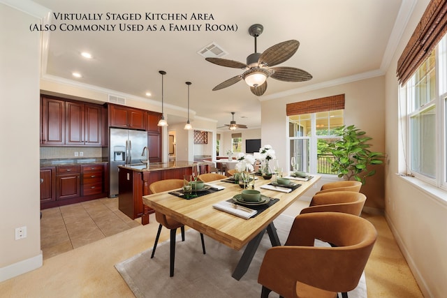 dining room with ceiling fan, light tile patterned flooring, and crown molding