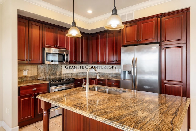 kitchen featuring sink, stainless steel appliances, backsplash, dark stone counters, and pendant lighting