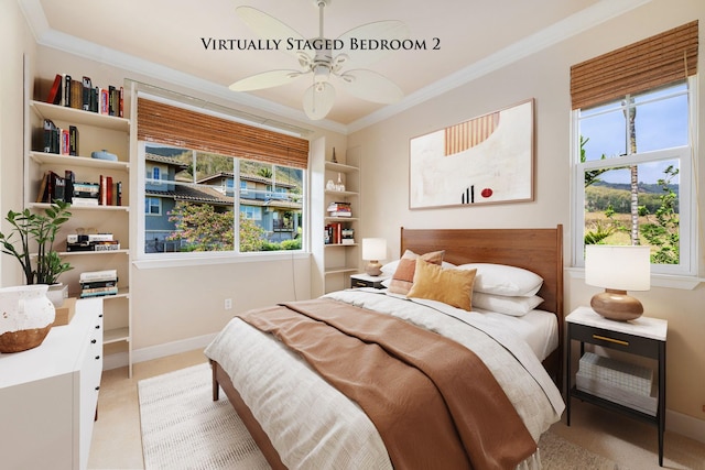 bedroom featuring ceiling fan, crown molding, and multiple windows