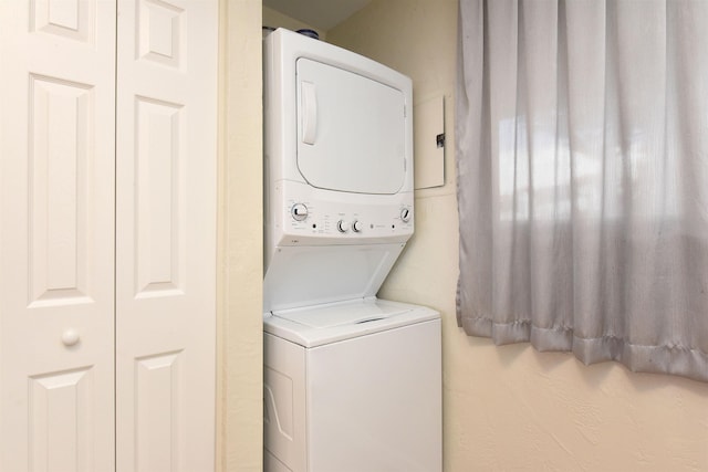 washroom with stacked washer and dryer