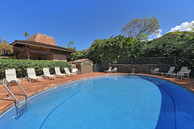 community pool featuring fence
