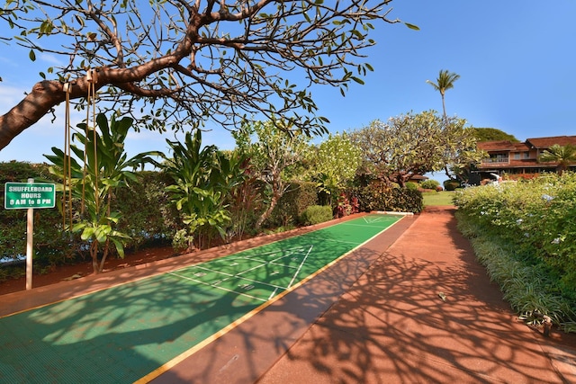 view of home's community featuring shuffleboard