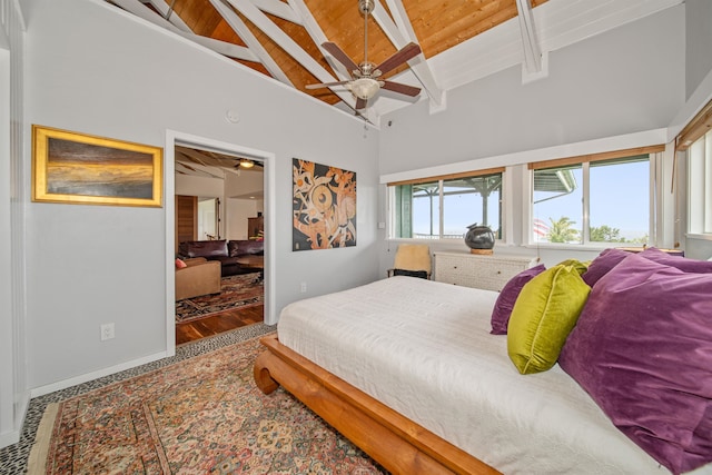 bedroom with ceiling fan, beamed ceiling, wood ceiling, high vaulted ceiling, and hardwood / wood-style flooring