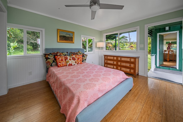 bedroom featuring ceiling fan, hardwood / wood-style flooring, and access to outside