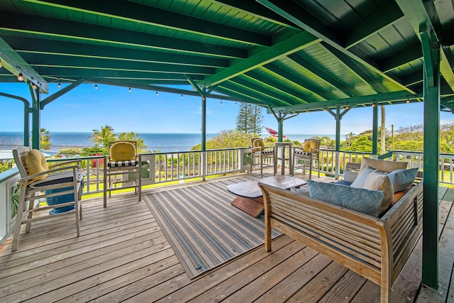 wooden deck featuring a water view