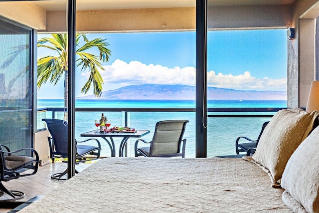 tiled bedroom with multiple windows and a water and mountain view