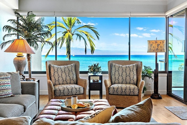 interior space featuring hardwood / wood-style flooring and a water view