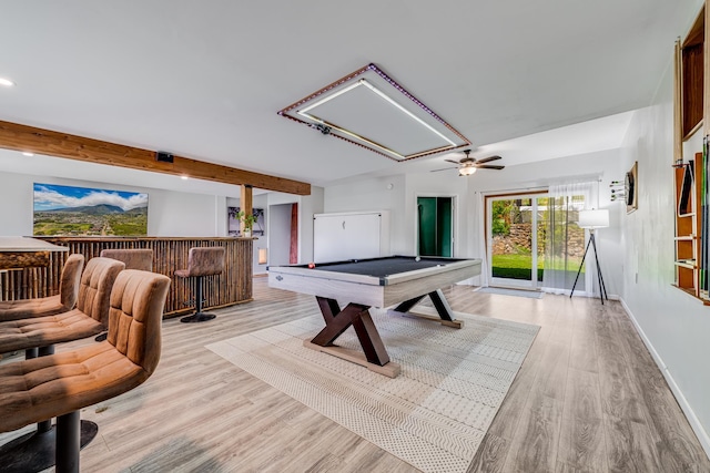 recreation room featuring beamed ceiling, billiards, light hardwood / wood-style flooring, ceiling fan, and indoor bar