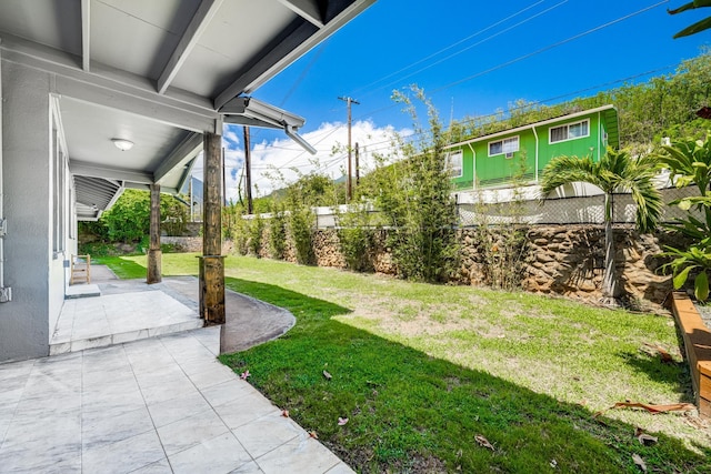 view of yard featuring a patio area and fence