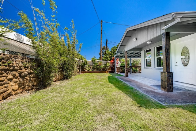 view of yard featuring a patio area and fence