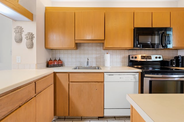 kitchen with white dishwasher, decorative backsplash, stainless steel electric range oven, and sink