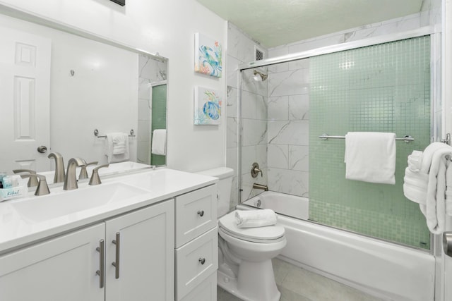 full bathroom with tile patterned flooring, vanity, toilet, and enclosed tub / shower combo