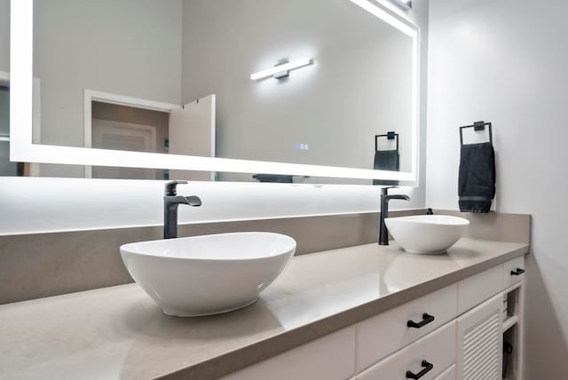 bathroom with double vanity and a sink